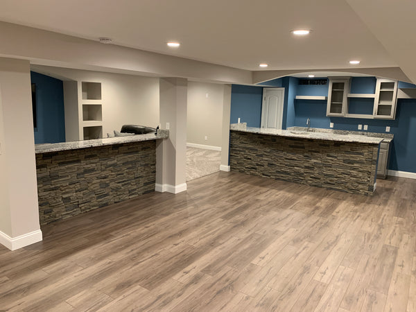 Lightning Ridge faux stone panel in Gray Fox – basement wall installed by a DIY homeowner