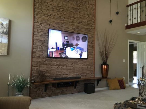 Canyon's Edge faux stone panel in Gray Fox – accent wall installed by a DIY homeowner