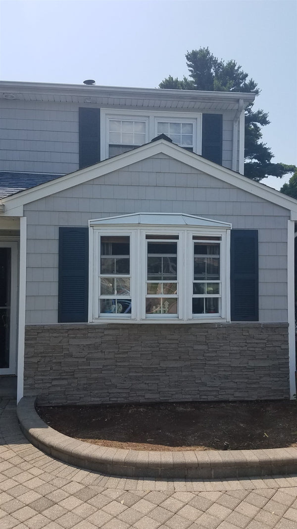 Canyon's Edge faux stone panel in Gray Fox – exterior siding installed by a DIY homeowner