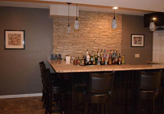 Canyon's Edge faux stone panel in Gray Fox – basement wall and accent wall installed by a DIY homeowner