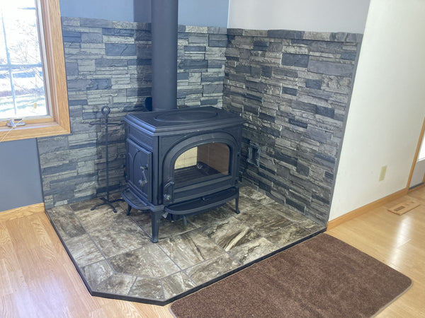 Earth's Valley faux stone panel in Gray Fox – fireplace surround and accent wall installed by a DIY homeowner