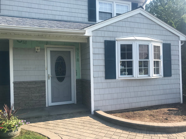Earth's Valley faux stone panel in Oyster Gray – exterior siding