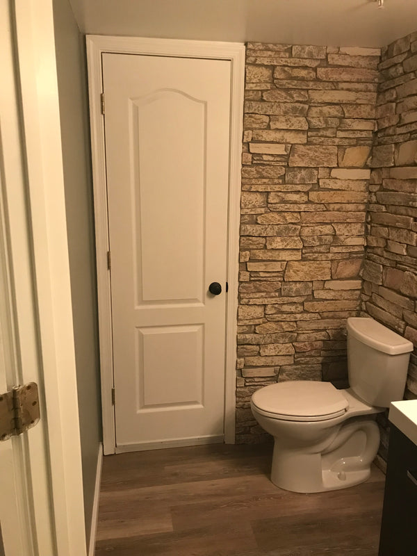 Harvest Ledge faux stone panel in Frosted Blush – bathroom wall and accent wall installed by a DIY homeowner