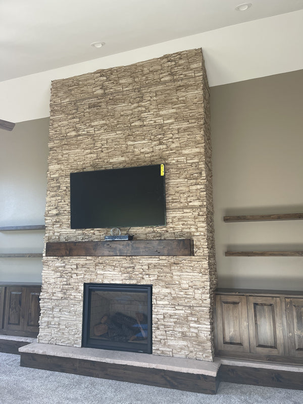 Lightning Ridge faux stone panel in Biscotti Tan – fireplace surround and accent wall installed by a DIY homeowner