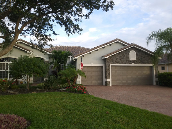 Lightning Ridge faux stone panel in Gray Fox – exterior siding and front yard installed by a DIY homeowner