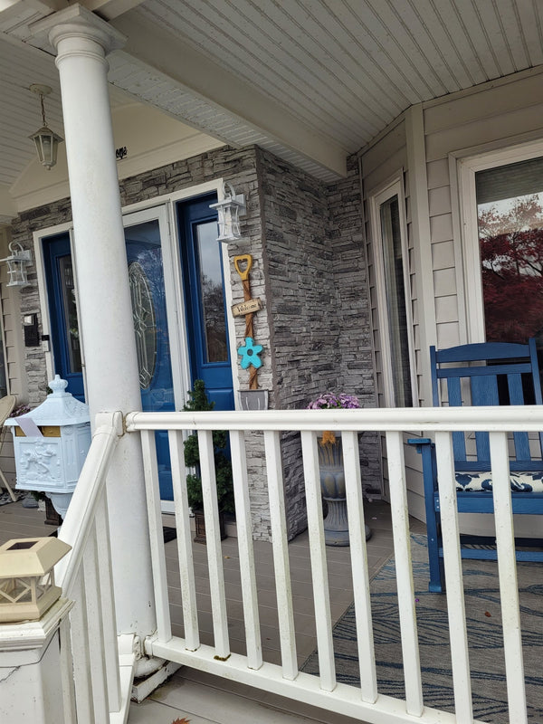Lightning Ridge faux stone panel in Moonlight Gray – exterior siding installed by a DIY homeowner
