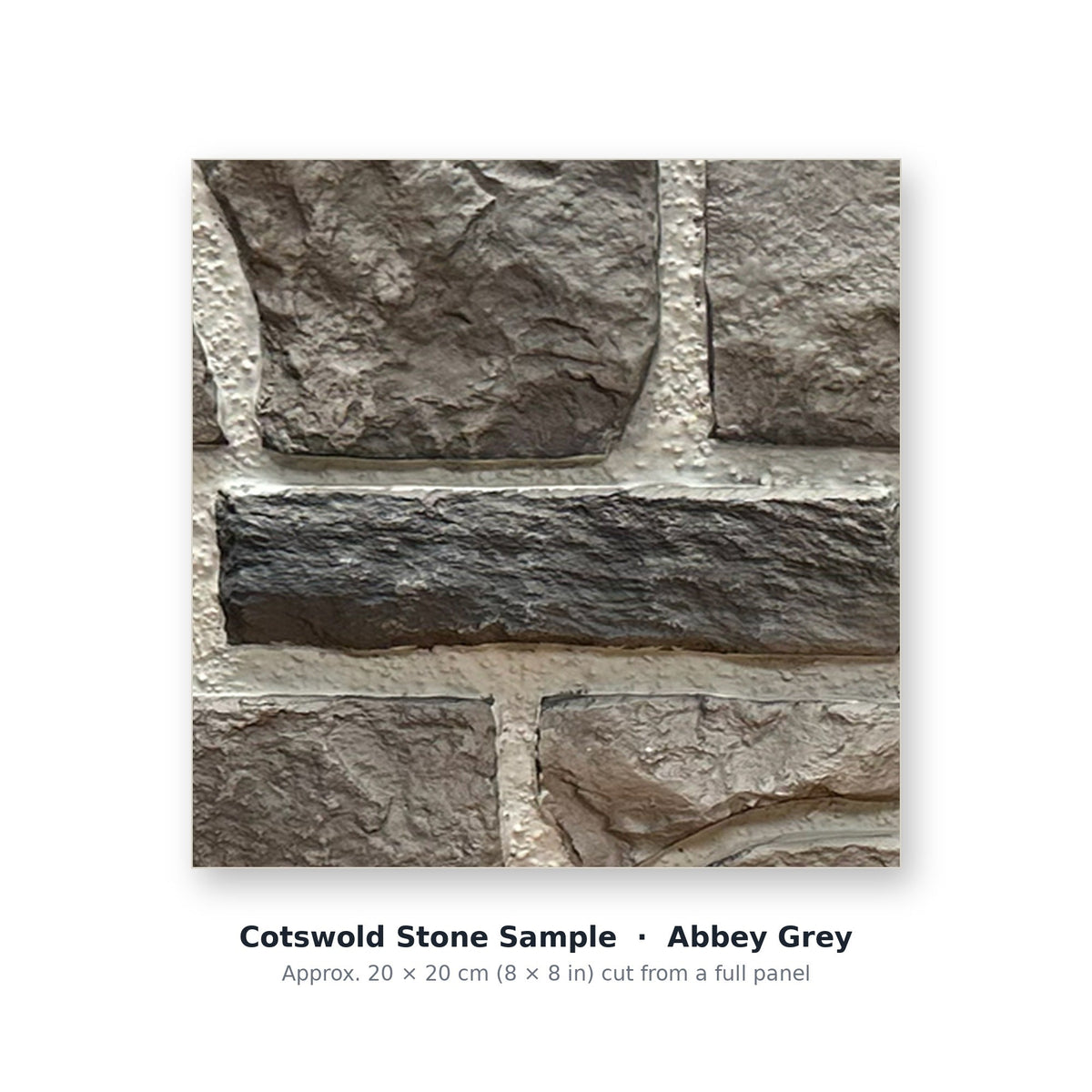 Cotswold Stone sample piece in Abbey Gray, cut from the full faux limestone panel