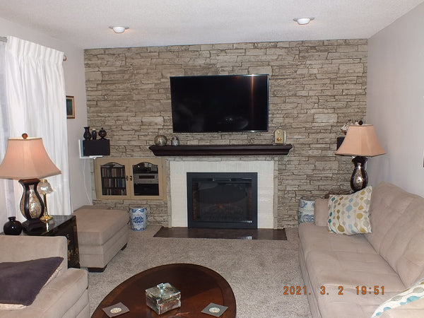 British Brick faux brick panel in Coconut White – fireplace surround and accent wall installed by a DIY homeowner