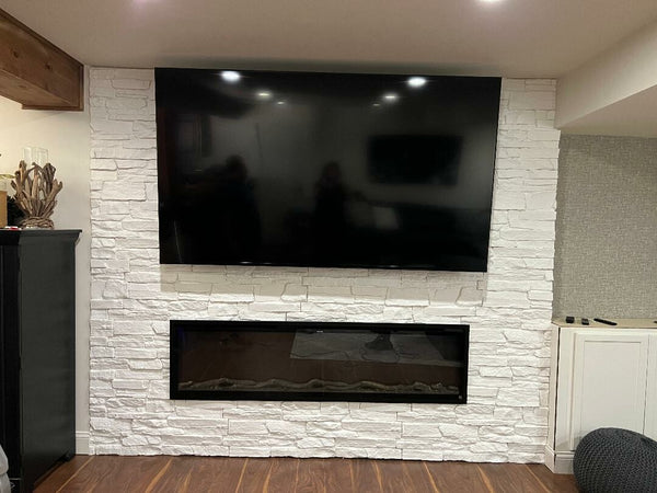 Canyon's Edge faux stone panel in Coconut White – fireplace surround and accent wall installed by a DIY homeowner