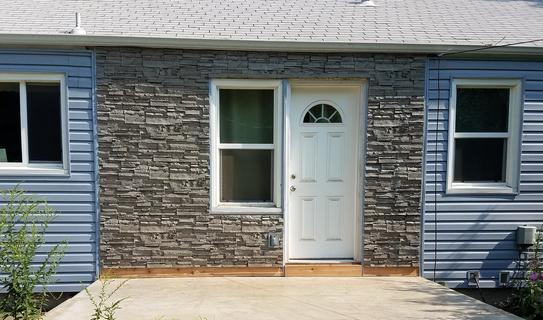 Canyon's Edge faux stone panel in Gray Fox – exterior siding installed by a DIY homeowner