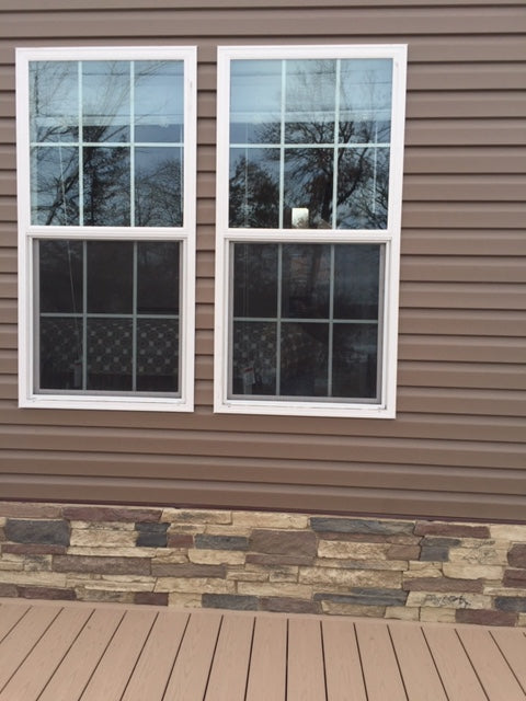 Canyon's Edge faux stone panel in Gray Fox – exterior siding installed by a DIY homeowner
