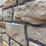 Close-up of Cotswold Stone in Antique Honey showing the creamy honey limestone texture and irregular stone faces