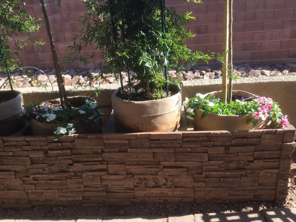 Earth's Valley faux stone panel in Cappuccino – front yard installed by a DIY homeowner