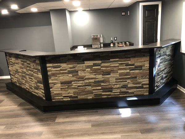 Earth's Valley faux stone panel in Nature's Spirit – basement wall installed by a DIY homeowner