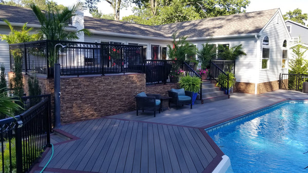 Lightning Ridge faux stone panel in Cappuccino – exterior siding and backyard installed by a DIY homeowner