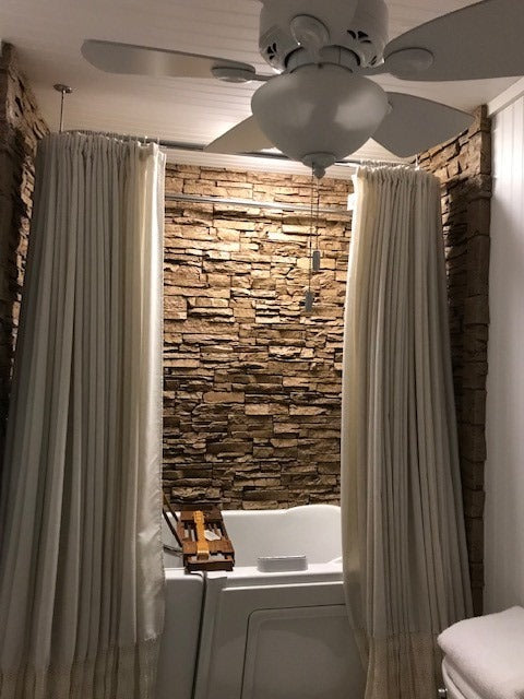 Lightning Ridge faux stone panel in Cappuccino – bathroom wall and accent wall installed by a DIY homeowner