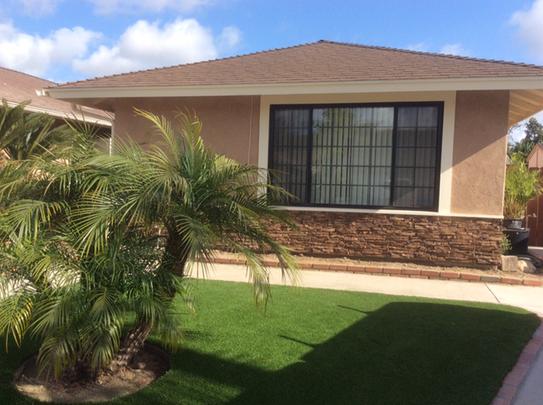 Lightning Ridge faux stone panel in Cappuccino – exterior siding installed by a DIY homeowner