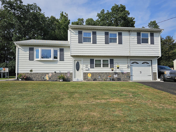 Lightning Ridge faux stone panel in Gray Fox – exterior siding installed by a DIY homeowner