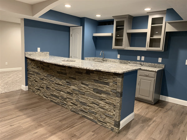 Lightning Ridge faux stone panel in Gray Fox – kitchen wall and basement wall installed by a DIY homeowner