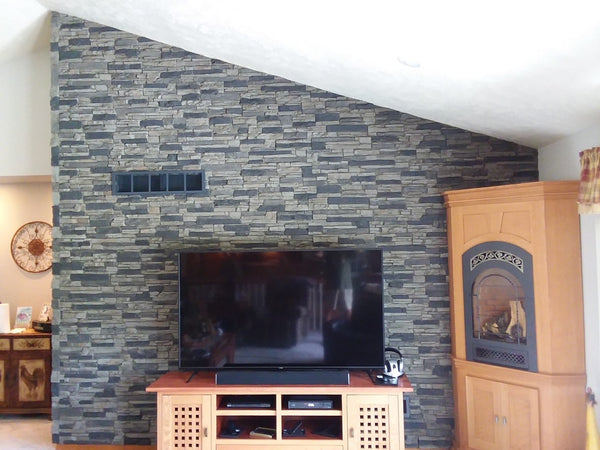 Lightning Ridge faux stone panel in Gray Fox – fireplace surround and accent wall installed by a DIY homeowner